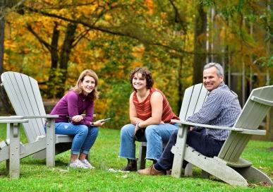 BMC family sitting in chairs outside